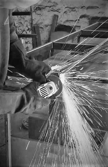 steel aquaiurm stand fabricated by Aquariums4Life working with steel grinding and steel sparjks